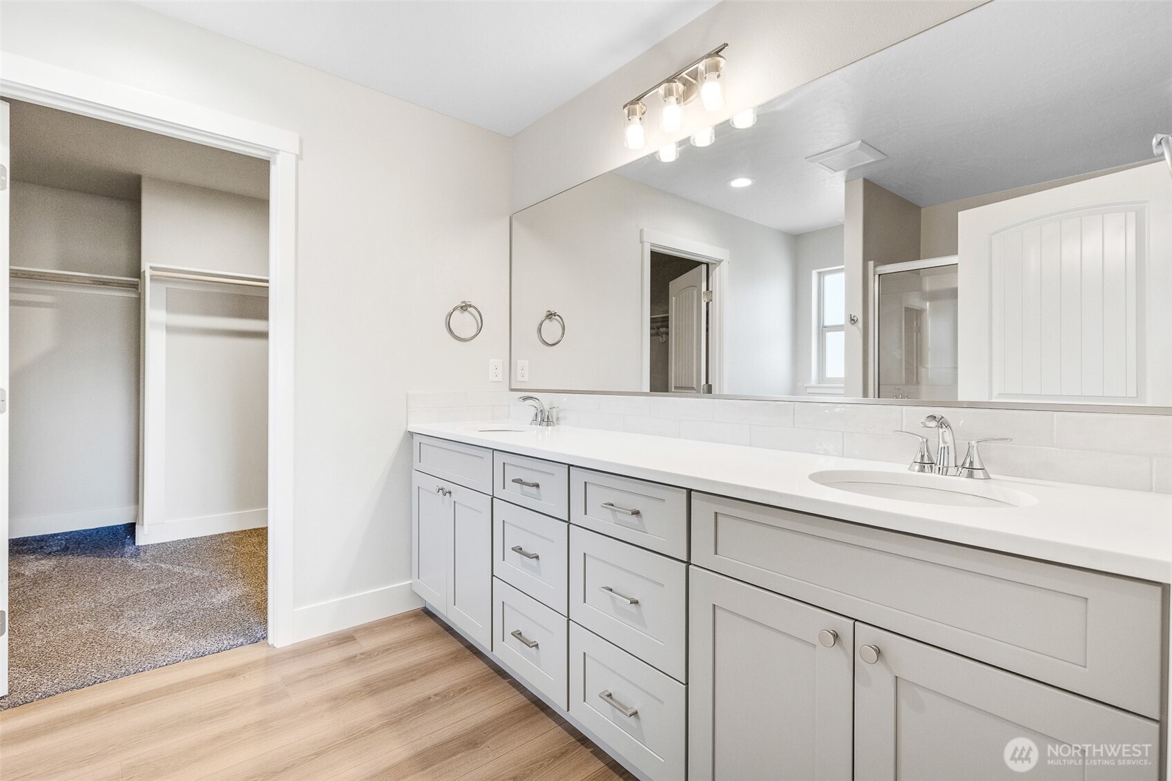 4246 Sandy Street Moses Lake, WA 98837 - Photo 21 of 29 a bath room with double vanity sink and a mirror