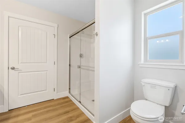 a white toilet sitting next to a bathroom sink
