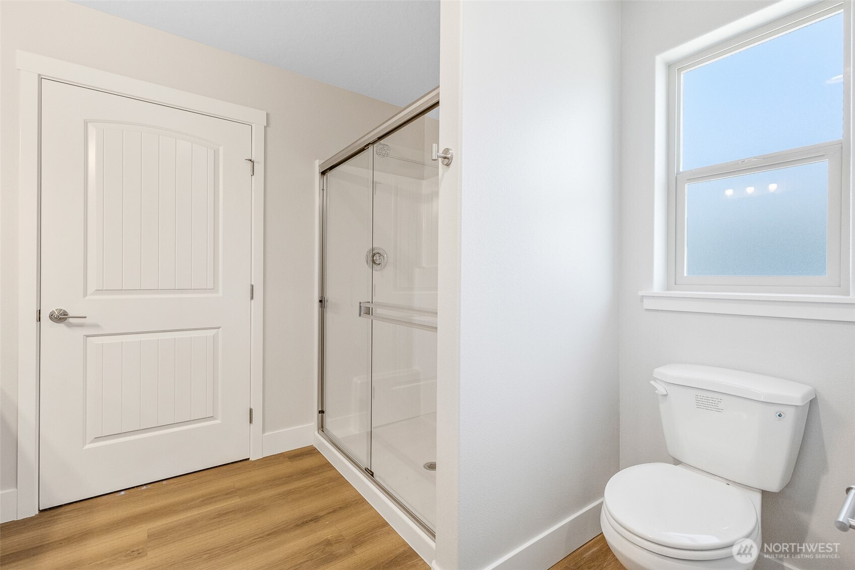 4246 Sandy Street Moses Lake, WA 98837 - Photo 22 of 29 a white toilet sitting next to a bathroom sink