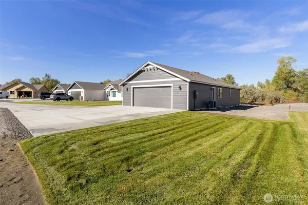a front view of a house with a yard