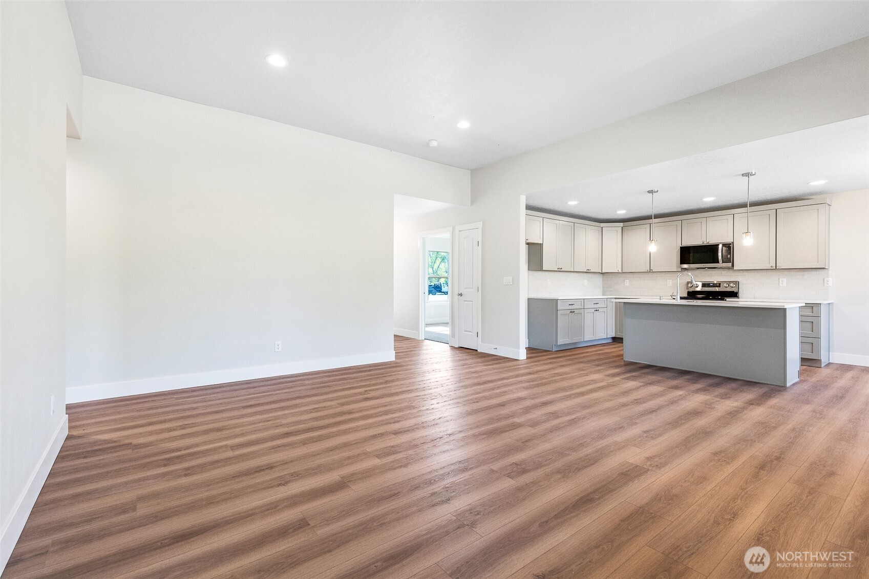4246 Sandy Street Moses Lake, WA 98837 - Photo 7 of 29 a view of kitchen with wooden floor and electronic appliances