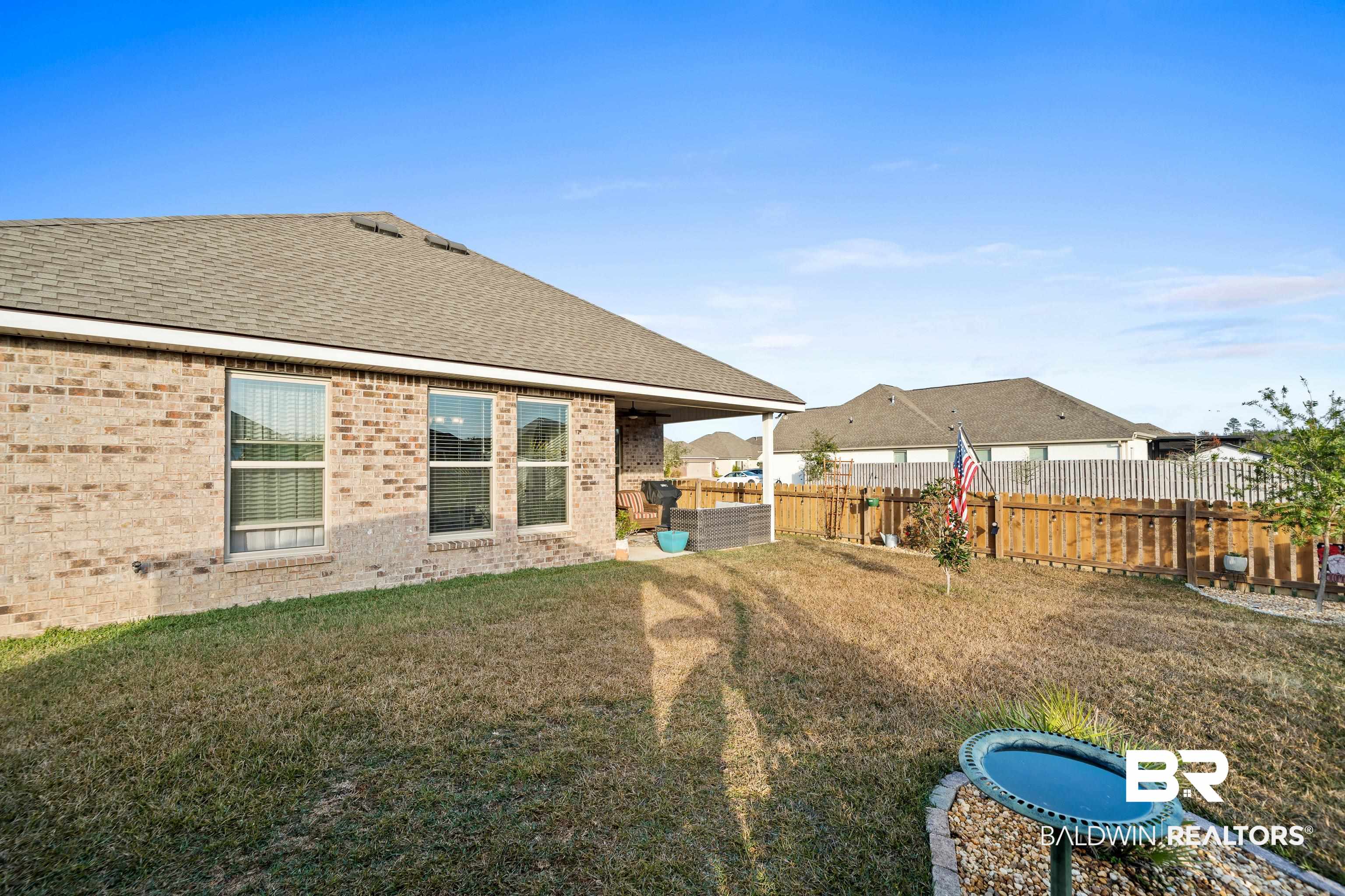 1390 Aldon Street Foley, AL 36535 - Photo 25 of 31 Fenced backyard featuring a patio area
