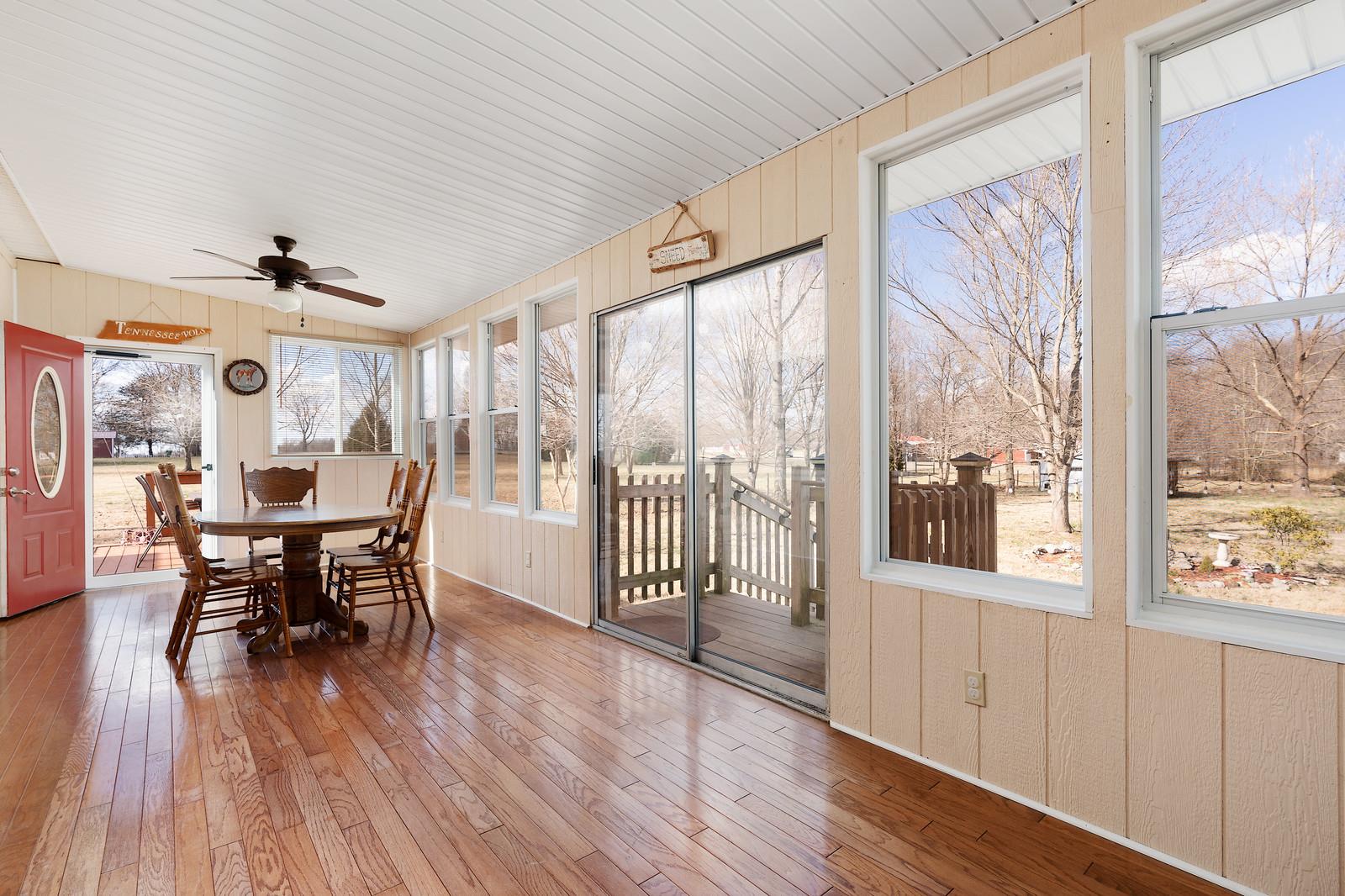2958 Kinneys Road Cedar Hill, TN 37032 - Photo 12 of 30 a view of a dining room with furniture window and wooden floor