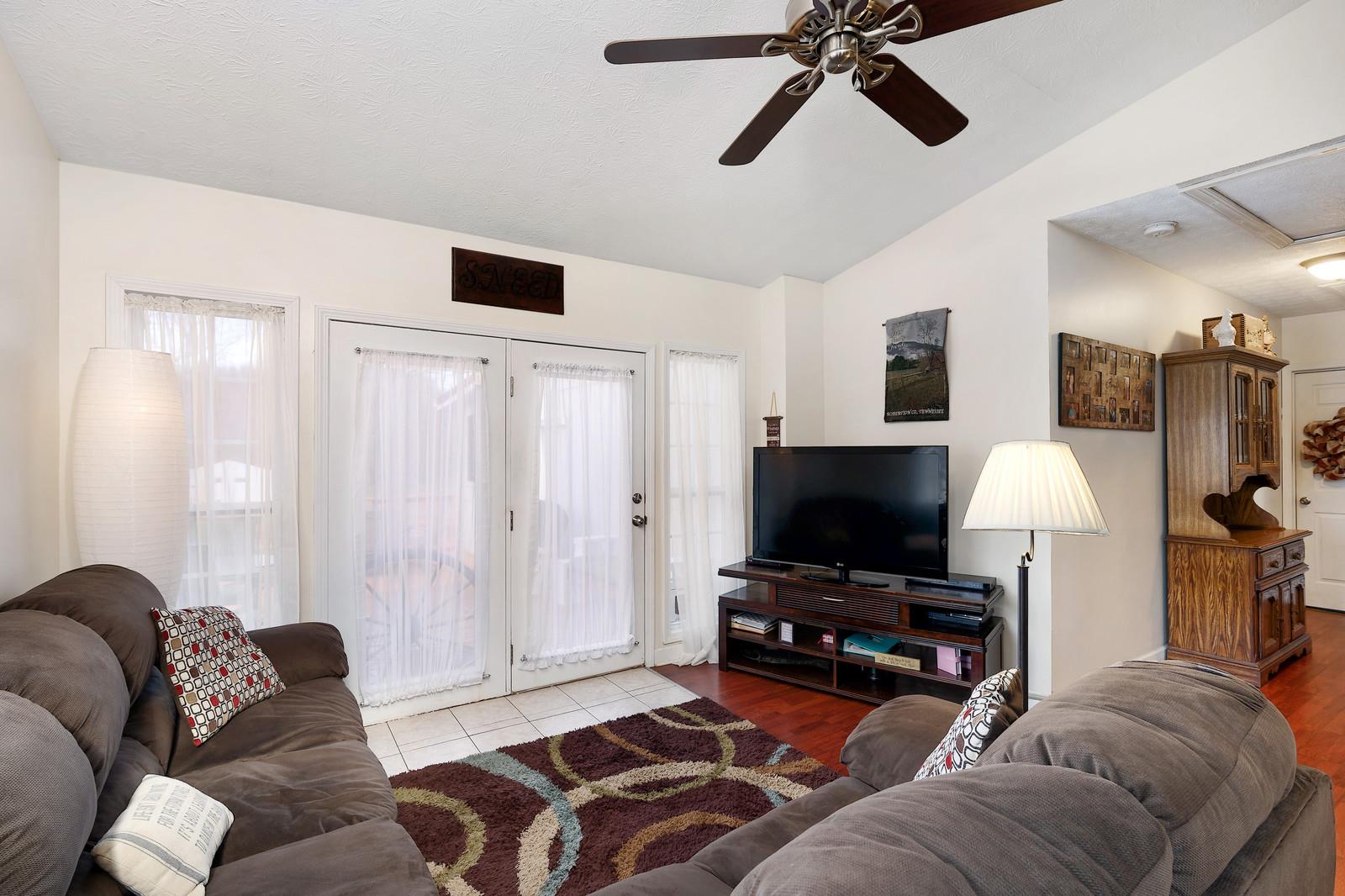 2958 Kinneys Road Cedar Hill, TN 37032 - Photo 15 of 30 a living room with furniture and a flat screen tv
