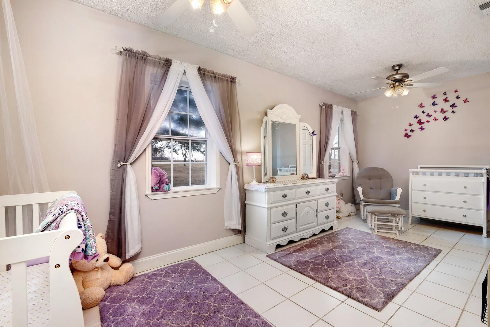 2958 Kinneys Road Cedar Hill, TN 37032 - Photo 23 of 30 a living room with furniture and a window