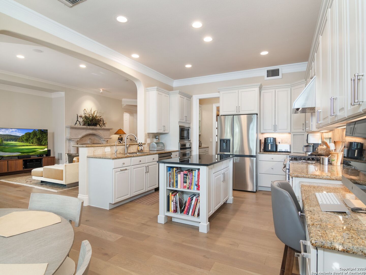 31 Stratton Lane San Antonio, TX 78257 - Photo 11 of 42 a kitchen with refrigerator and cabinets