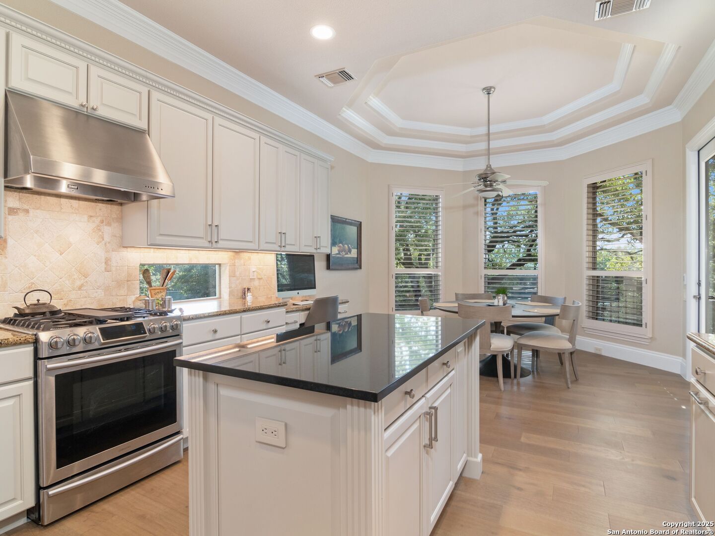 31 Stratton Lane San Antonio, TX 78257 - Photo 12 of 42 a kitchen with granite countertop a sink stove and cabinets