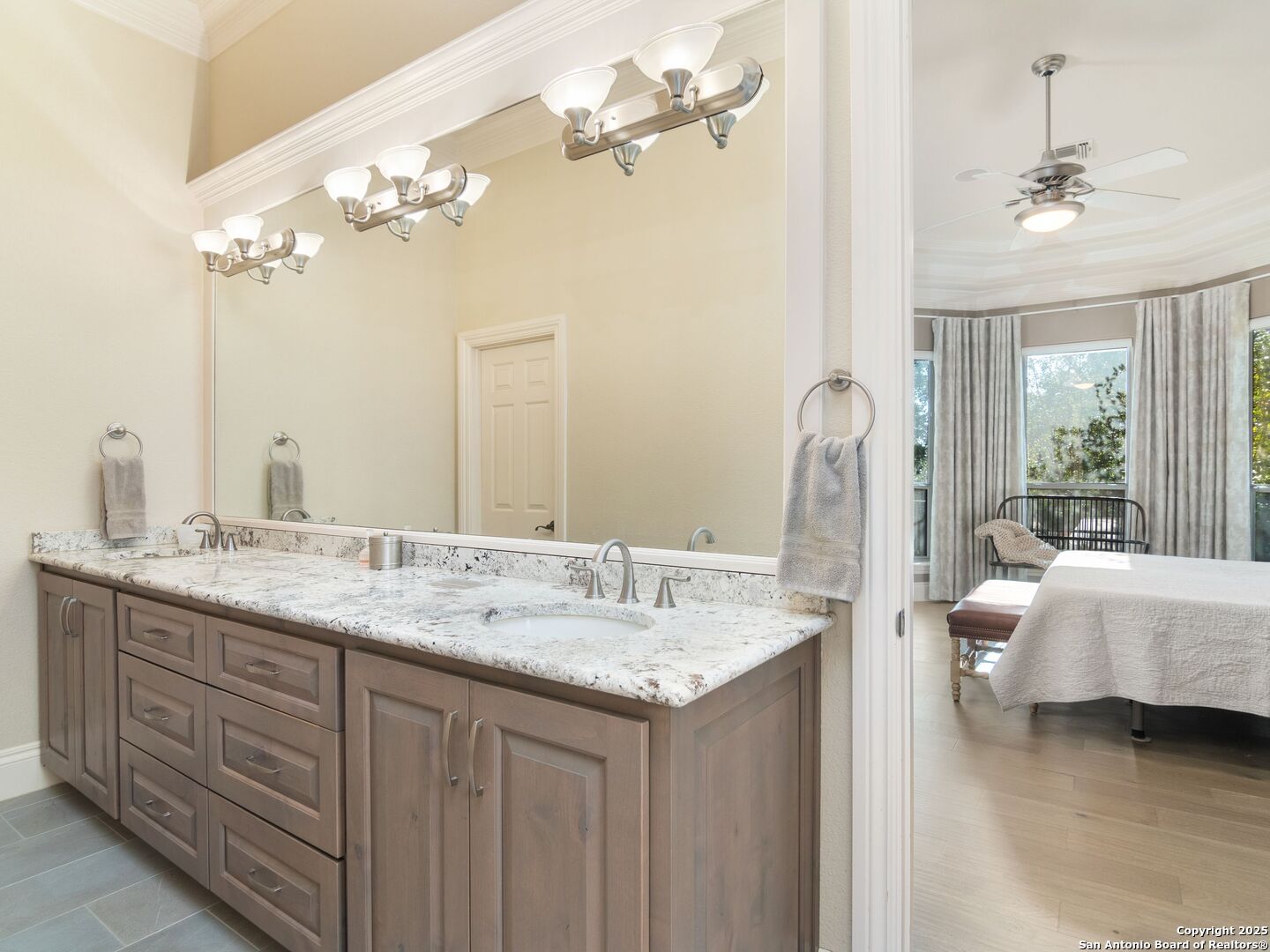 31 Stratton Lane San Antonio, TX 78257 - Photo 18 of 42 a en suite bathroom with a granite countertop double vanity and a mirror