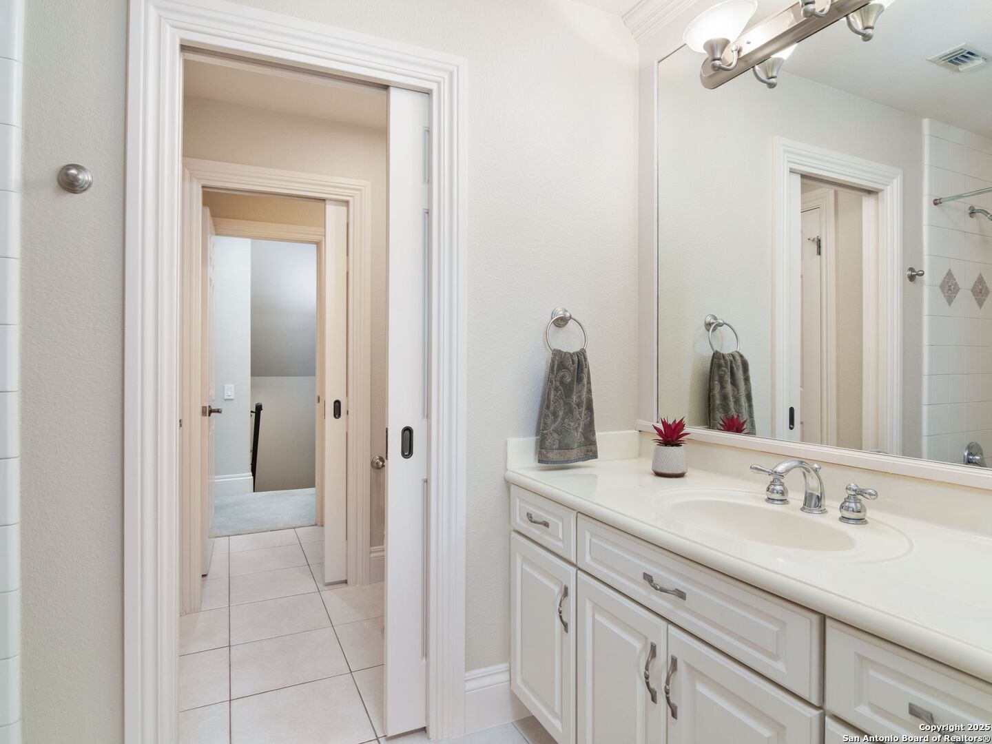 31 Stratton Lane San Antonio, TX 78257 - Photo 25 of 42 a bathroom with a sink and a mirror