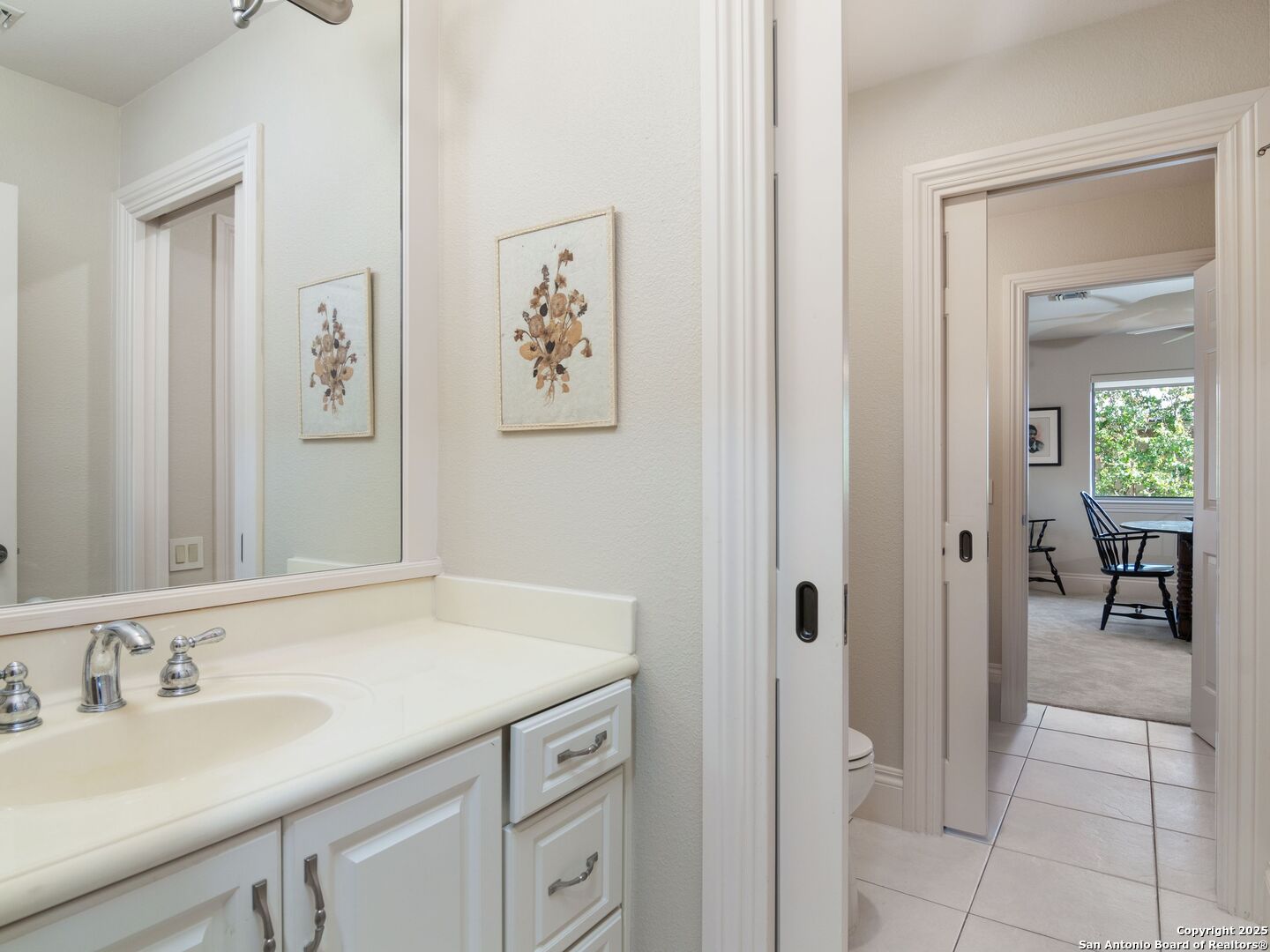 31 Stratton Lane San Antonio, TX 78257 - Photo 28 of 42 a bathroom with a sink and a mirror