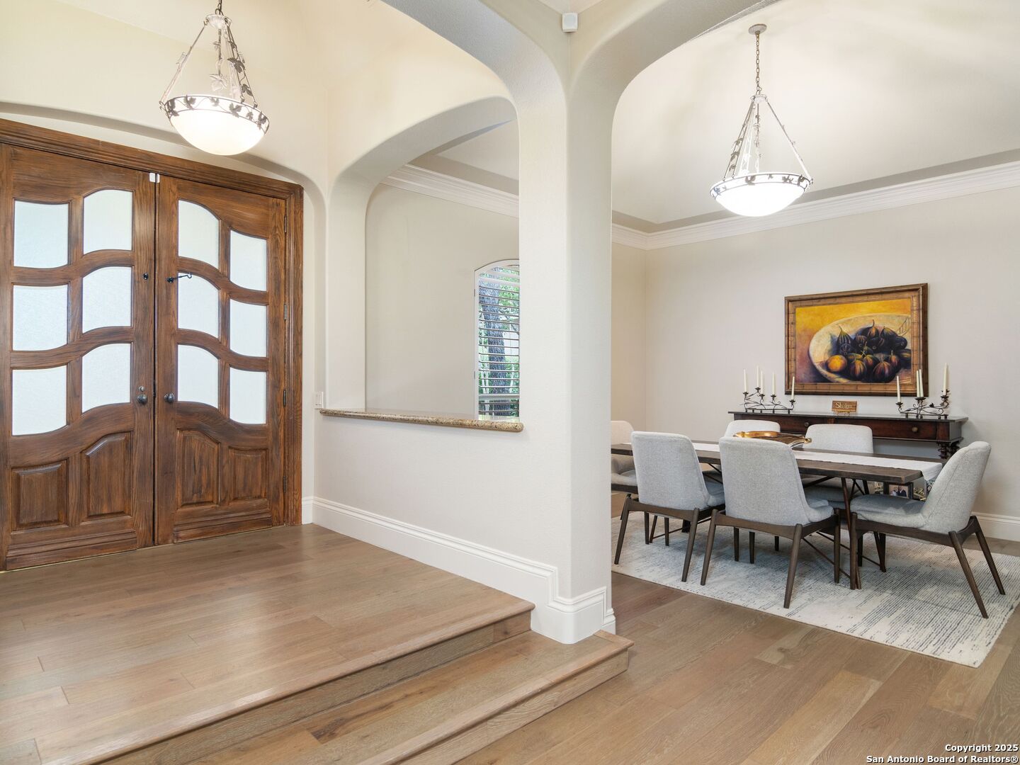 31 Stratton Lane San Antonio, TX 78257 - Photo 3 of 42 a view of a dining room with furniture a chandelier and wooden floor