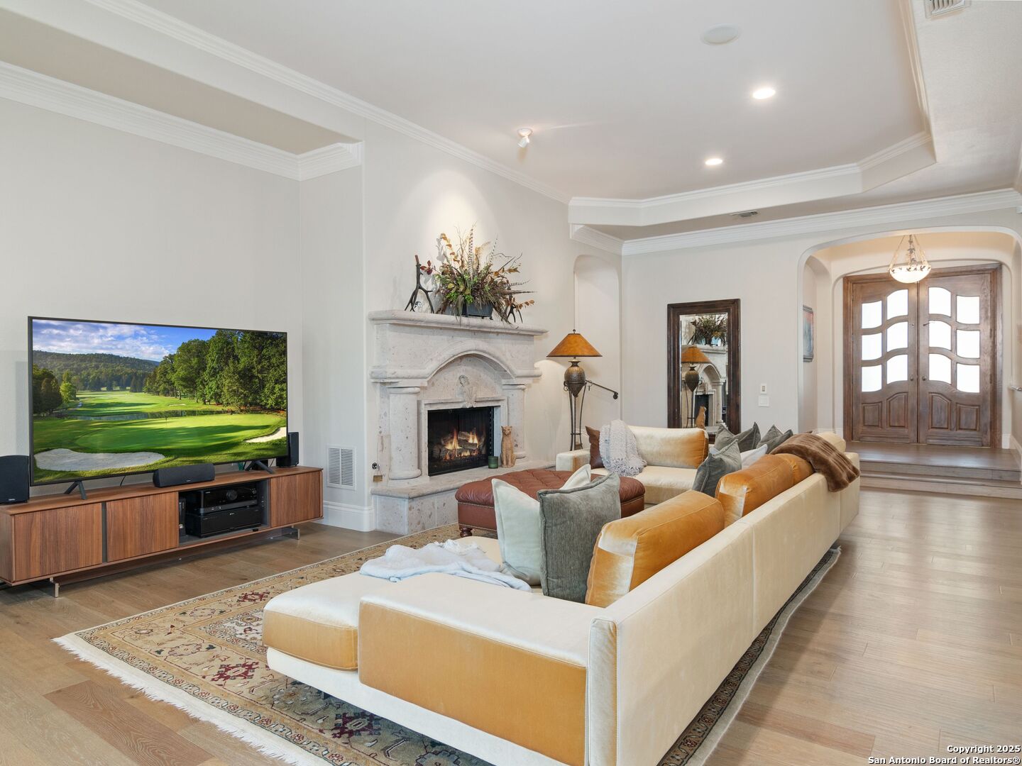 31 Stratton Lane San Antonio, TX 78257 - Photo 8 of 42 a living room with fireplace furniture and a flat screen tv