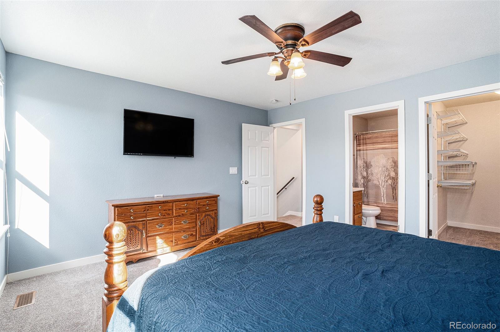 1085 Mockingbird Street Brighton, CO 80601 - Photo 11 of 21 a bedroom with a bed and a flat screen tv