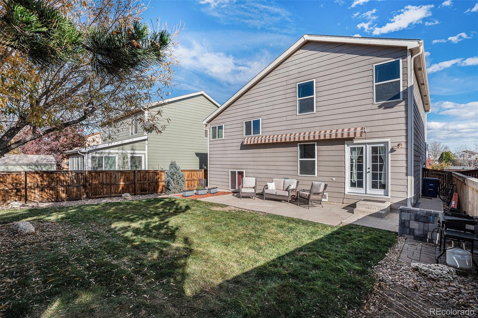 1085 Mockingbird Street Brighton, CO 80601 - Photo 16 of 21 a backyard of a house with seating space