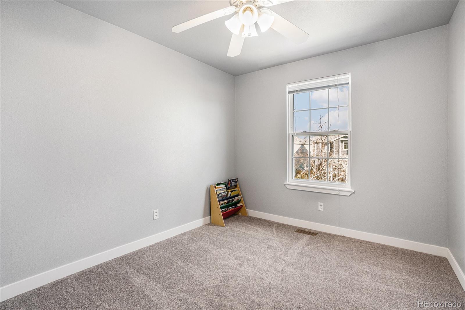 1085 Mockingbird Street Brighton, CO 80601 - Photo 17 of 21 an empty room with a window