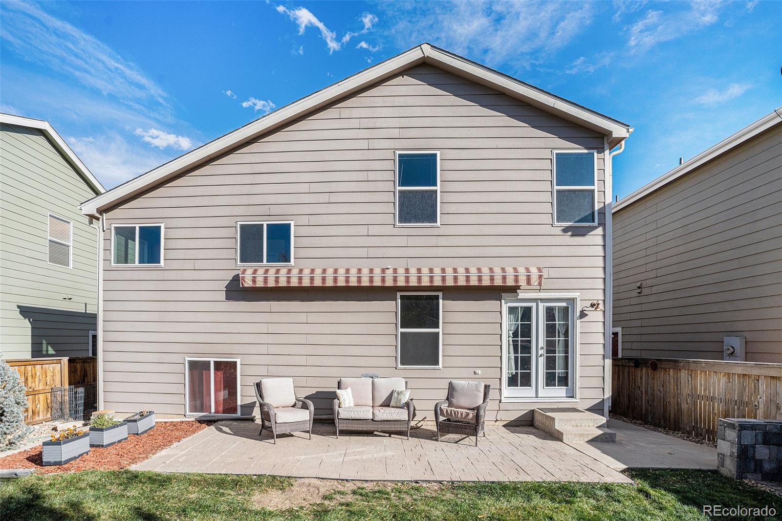 1085 Mockingbird Street Brighton, CO 80601 - Photo 20 of 21 a view of a house with yard and chairs