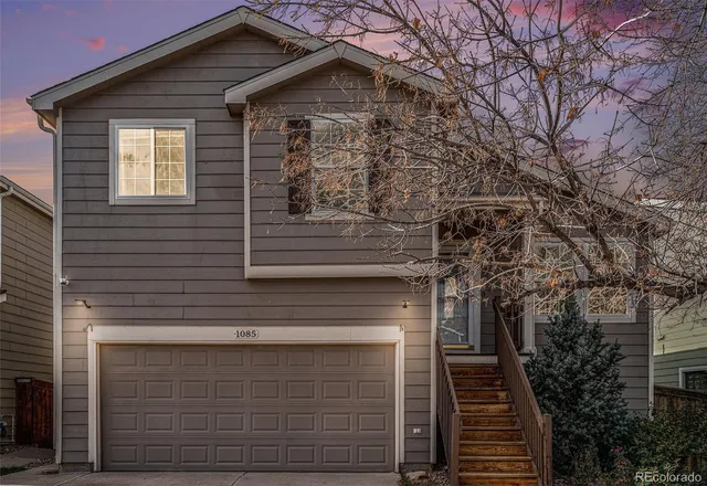a front view of a house with garage