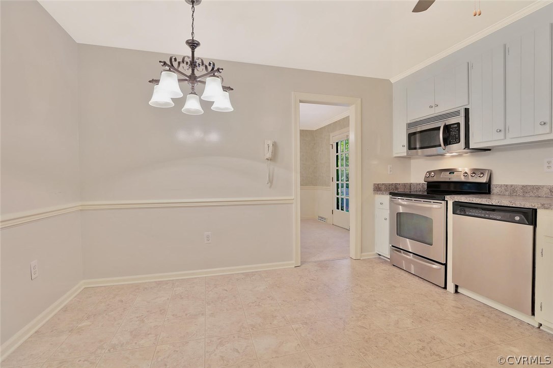 1930 Esquire Road North Chesterfield, VA 23235 - Photo 11 of 26 a kitchen with granite countertop white cabinets and white appliances