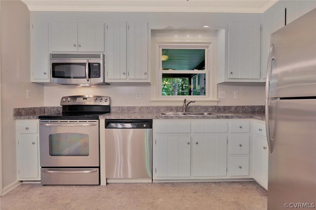 1930 Esquire Road North Chesterfield, VA 23235 - Photo 10 of 26 a kitchen with white cabinets and white appliances