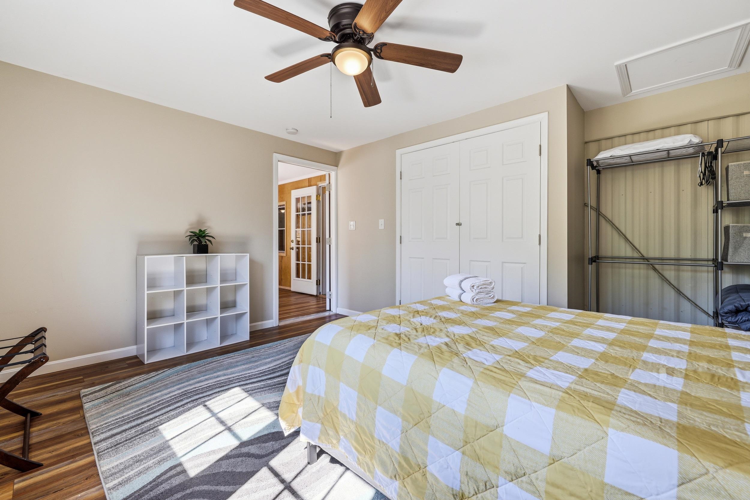 702 Richview Road Rileyville, VA 22650 - Photo 27 of 75 a bedroom with a bed and a chandelier