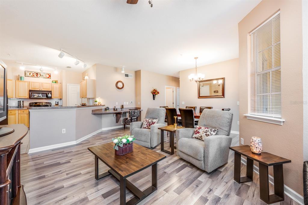 102 Terrace Ridge Circle, Unit 102 Davenport, FL 33896 - Photo 12 of 32 a living room with furniture and a large window