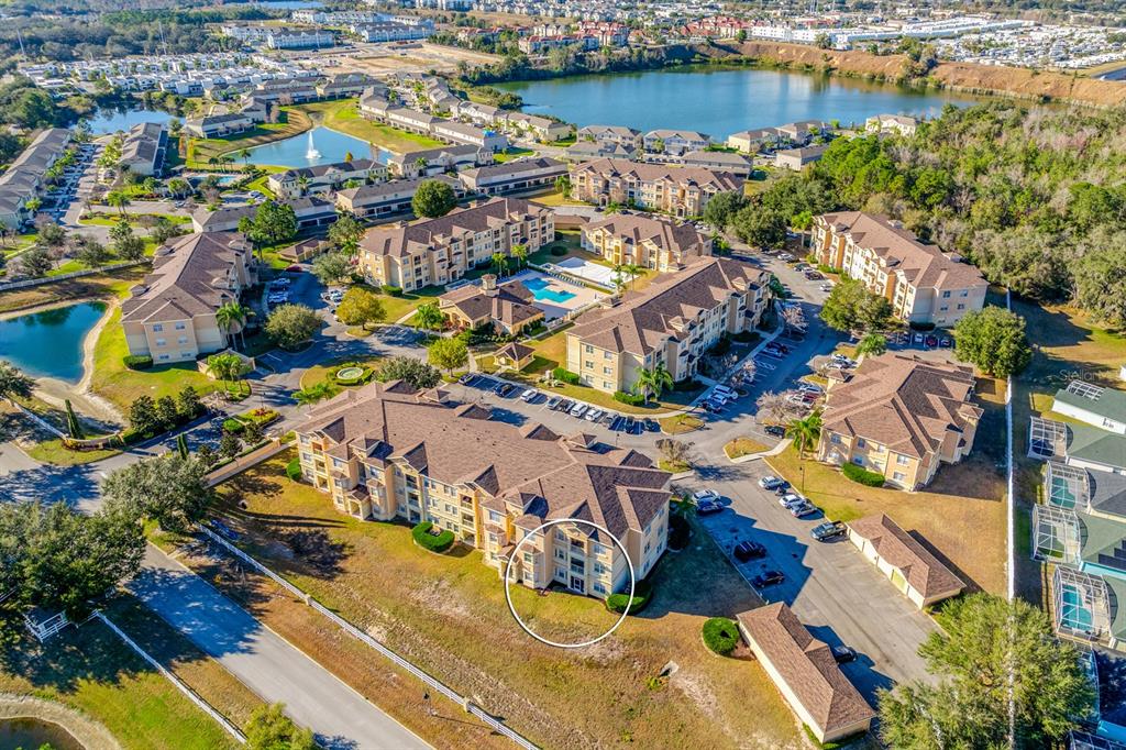 102 Terrace Ridge Circle, Unit 102 Davenport, FL 33896 - Photo 23 of 32 an aerial view of residential houses with outdoor space