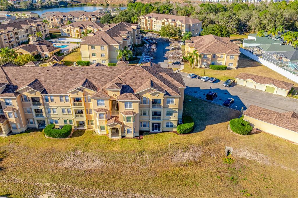 102 Terrace Ridge Circle, Unit 102 Davenport, FL 33896 - Photo 24 of 32 an aerial view of residential houses with yard