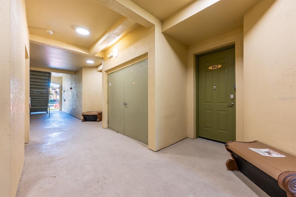 102 Terrace Ridge Circle, Unit 102 Davenport, FL 33896 - Photo 5 of 32 a view of a hallway with seating area