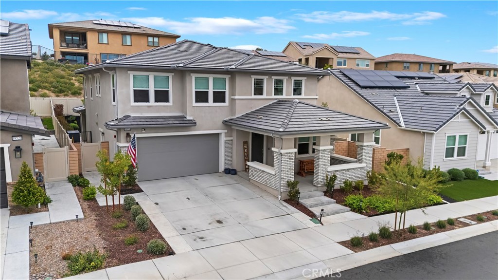 39526 Verbena Way Temecula, CA 92591 - Photo 12 of 55 a front view of a house with yard