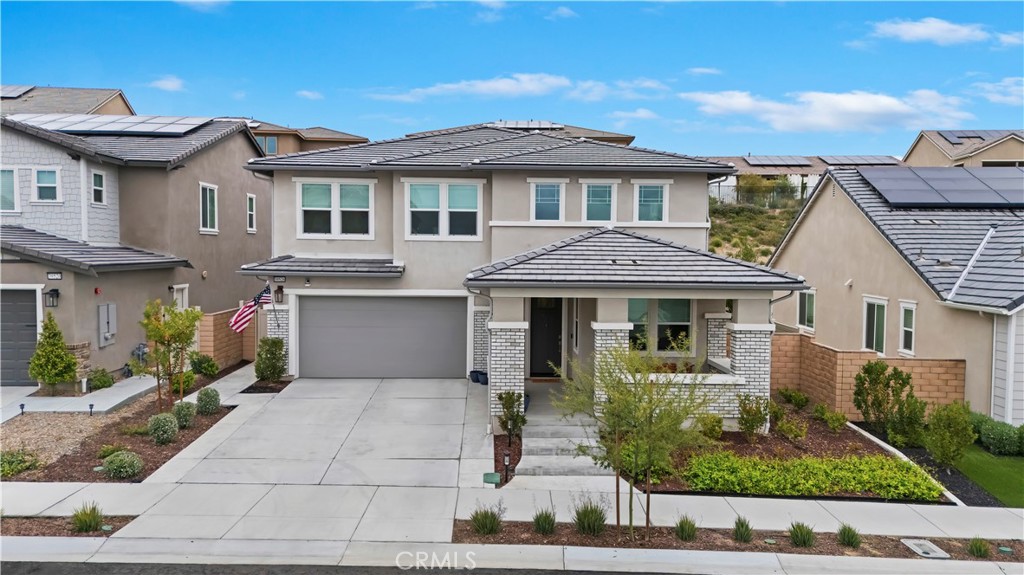 39526 Verbena Way Temecula, CA 92591 - Photo 13 of 55 a front view of a house with garden