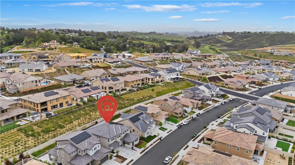 39526 Verbena Way Temecula, CA 92591 - Photo 14 of 55 an aerial view of residential building and parking space