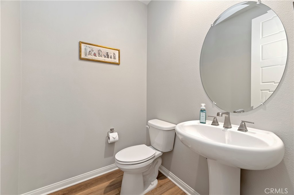 39526 Verbena Way Temecula, CA 92591 - Photo 19 of 55 a bathroom with a sink and a toilet