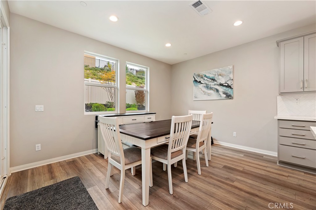 39526 Verbena Way Temecula, CA 92591 - Photo 22 of 55 a view of a dining room with furniture window and wooden floor