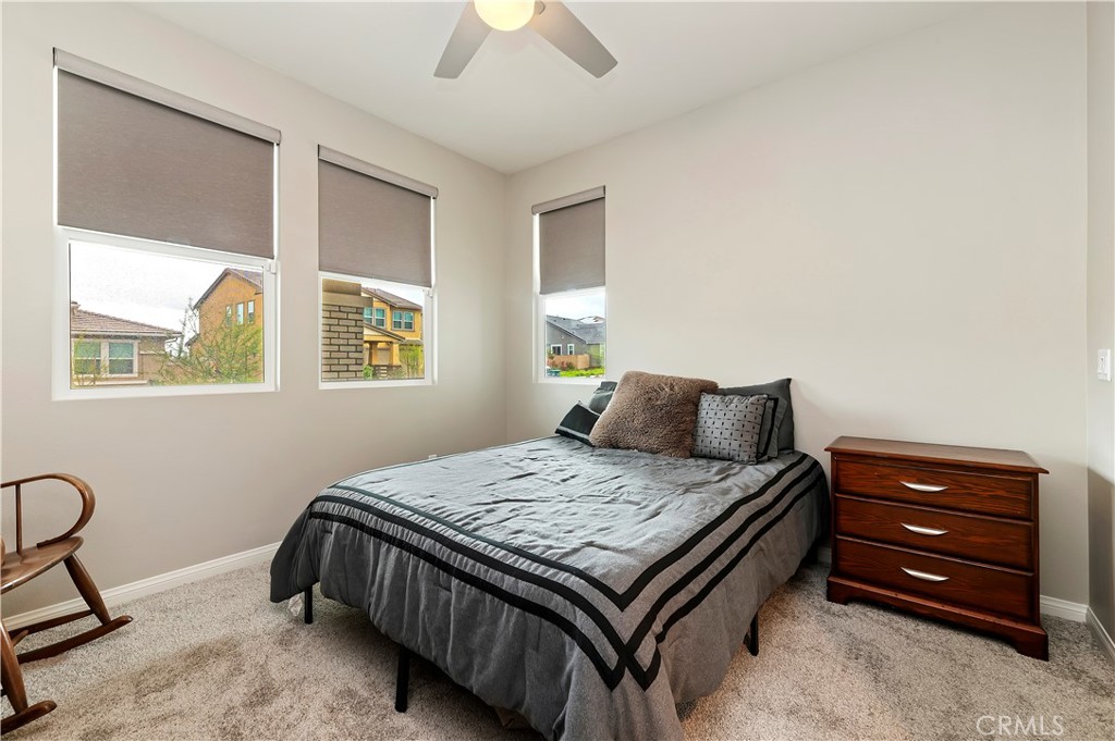 39526 Verbena Way Temecula, CA 92591 - Photo 26 of 55 a bedroom with a bed and a dresser
