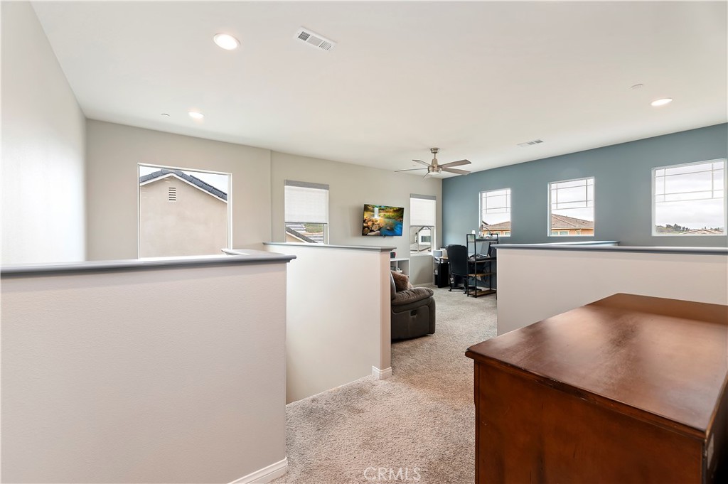 39526 Verbena Way Temecula, CA 92591 - Photo 28 of 55 a kitchen with a refrigerator and a sink