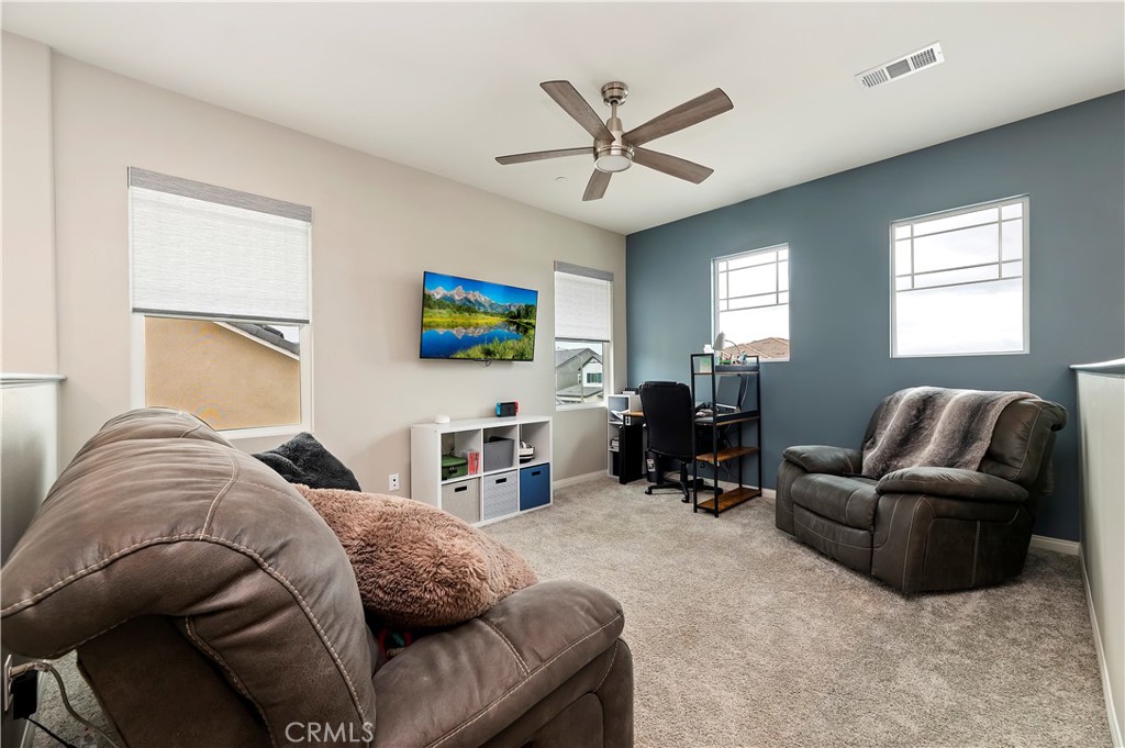 39526 Verbena Way Temecula, CA 92591 - Photo 29 of 55 a living room with furniture and a large window