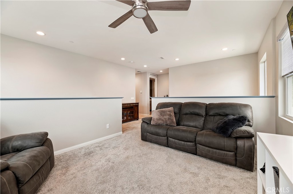 39526 Verbena Way Temecula, CA 92591 - Photo 30 of 55 a living room with furniture and a couch