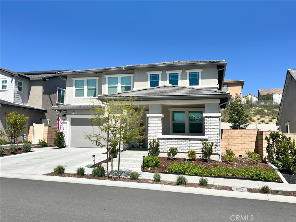 39526 Verbena Way Temecula, CA 92591 - Photo 3 of 55 a front view of a house with a yard