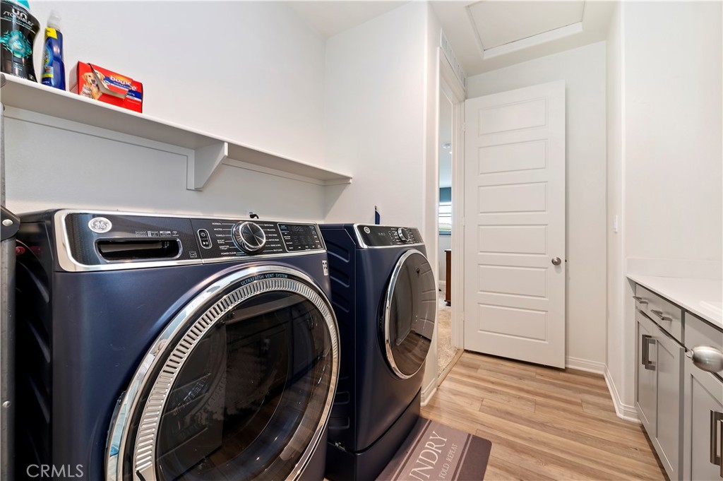 39526 Verbena Way Temecula, CA 92591 - Photo 35 of 55 a utility room with dryer and washer