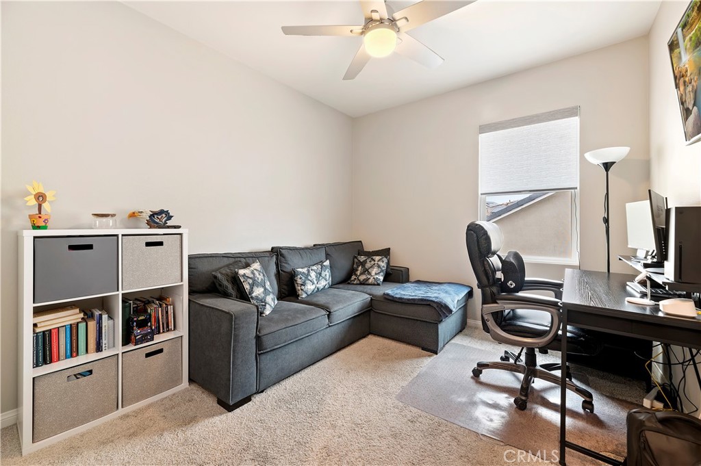 39526 Verbena Way Temecula, CA 92591 - Photo 37 of 55 a work room with furniture and a bookshelf