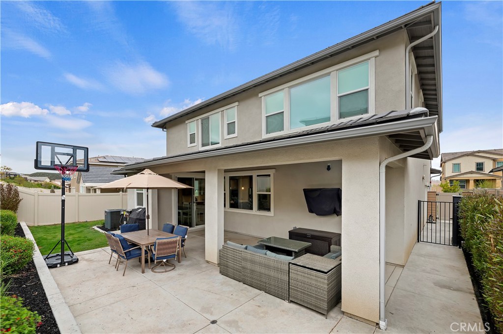 39526 Verbena Way Temecula, CA 92591 - Photo 42 of 55 a view of a patio with a table and chairs
