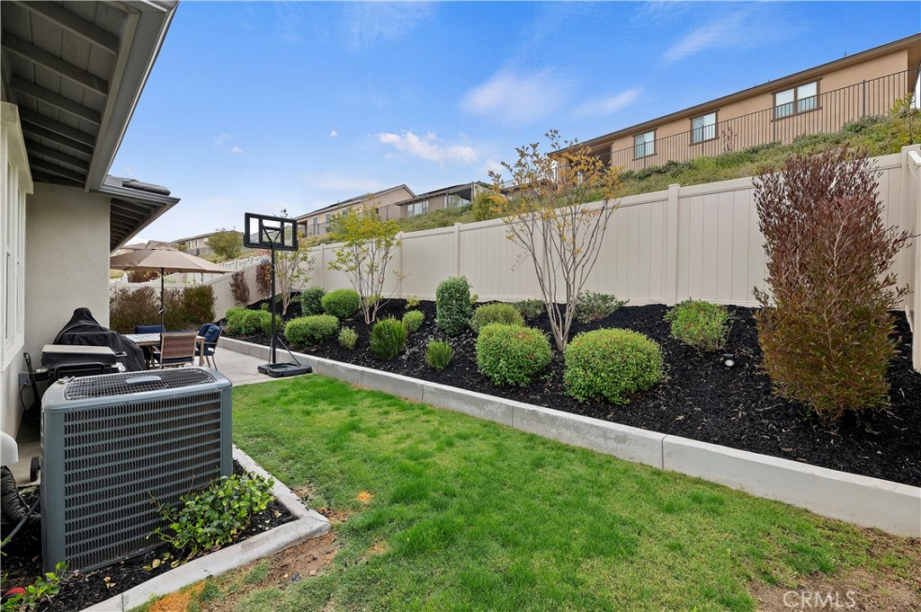39526 Verbena Way Temecula, CA 92591 - Photo 44 of 55 a view of a back yard of the house and cars parked