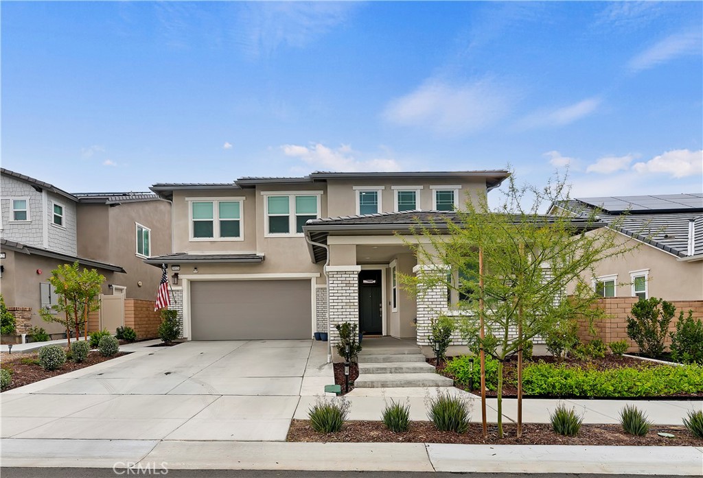 39526 Verbena Way Temecula, CA 92591 - Photo 8 of 55 a front view of a house with garage