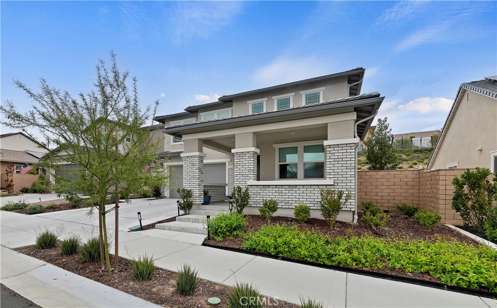 39526 Verbena Way Temecula, CA 92591 - Photo 9 of 55 a front view of a house with a yard