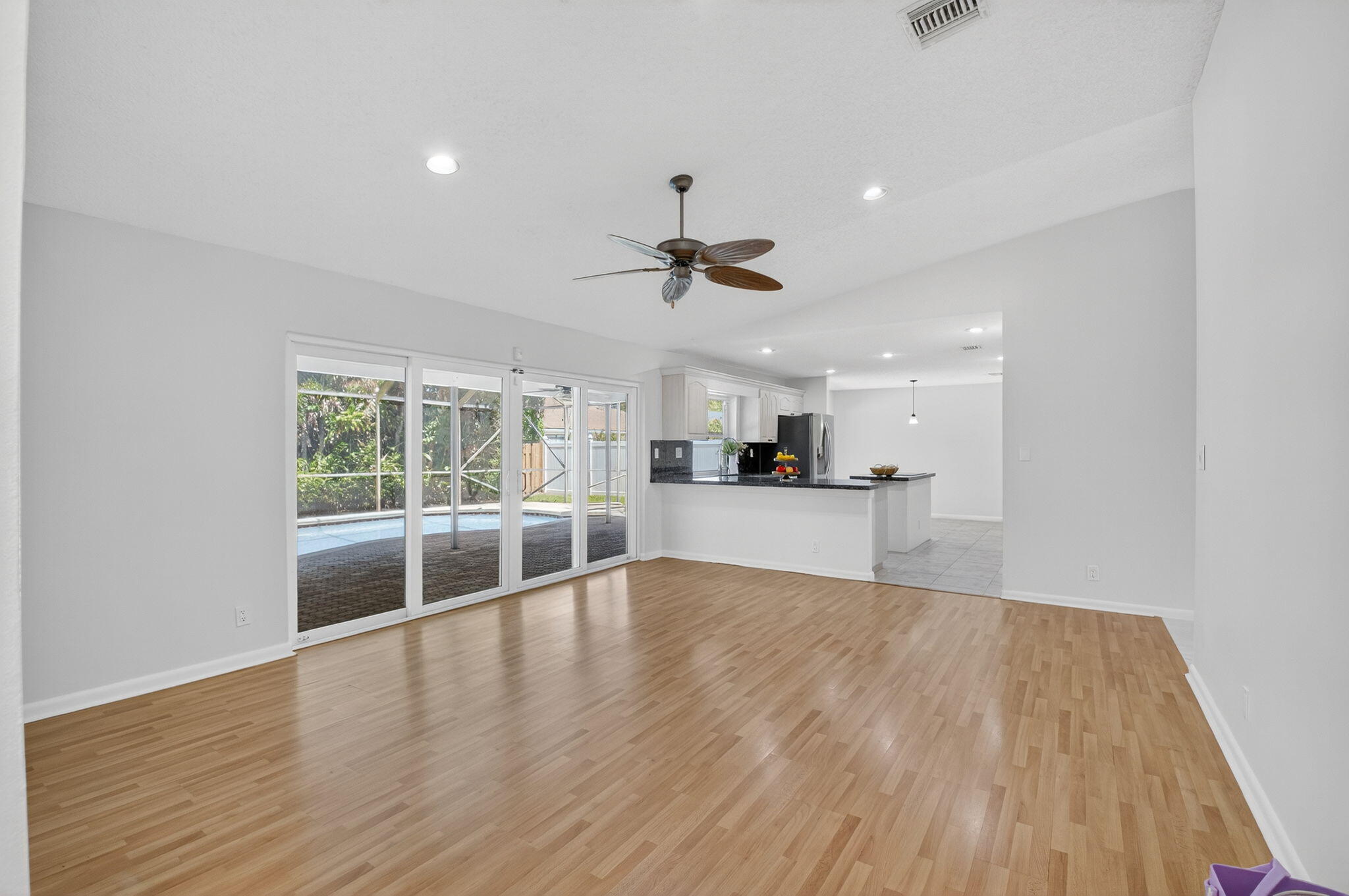 17414 Springtree Lane Boca Raton, FL 33487 - Photo 15 of 49 a view of a kitchen with a sink and wooden floor