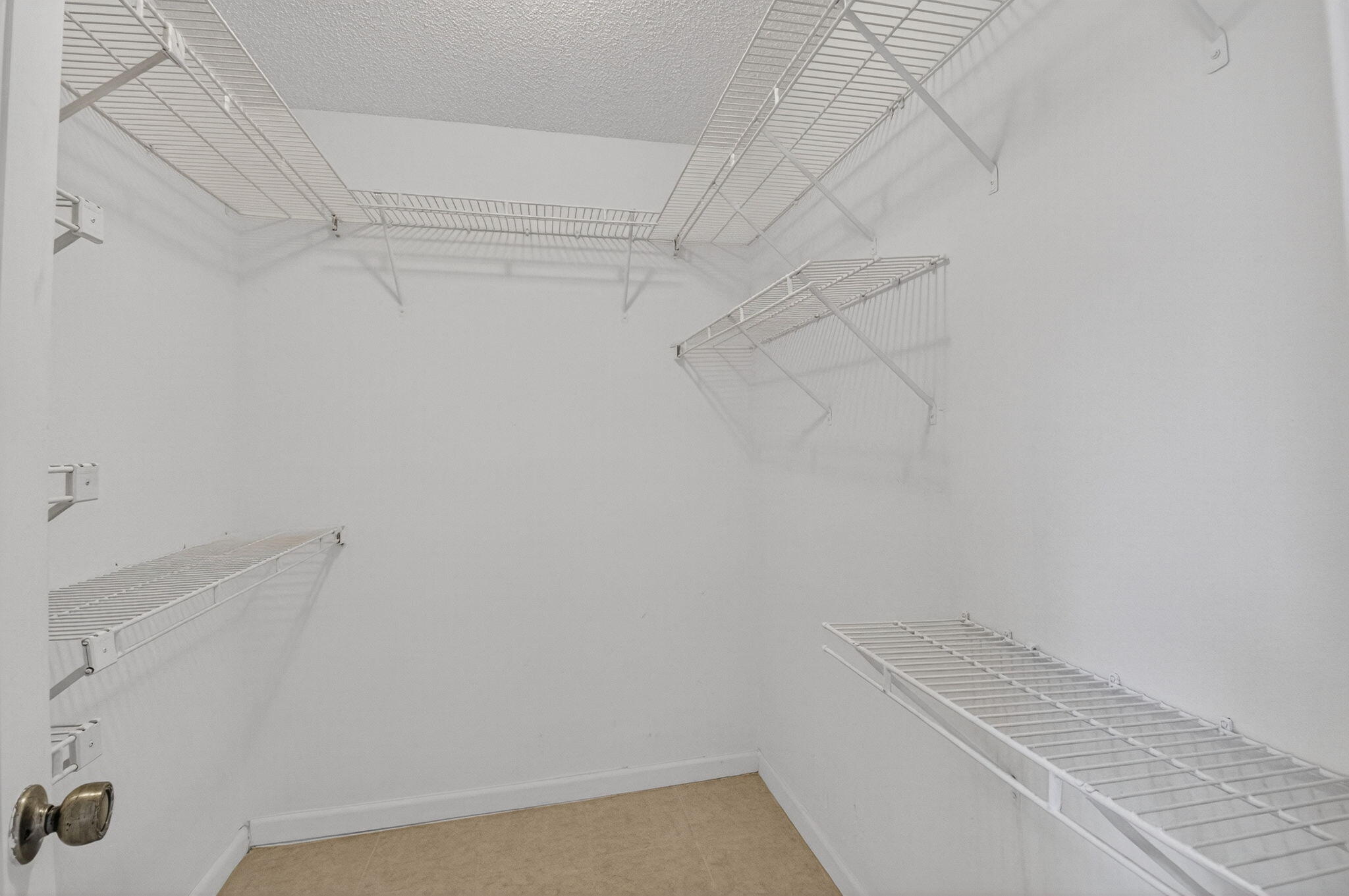 17414 Springtree Lane Boca Raton, FL 33487 - Photo 28 of 49 a view of a room with racks on the wall