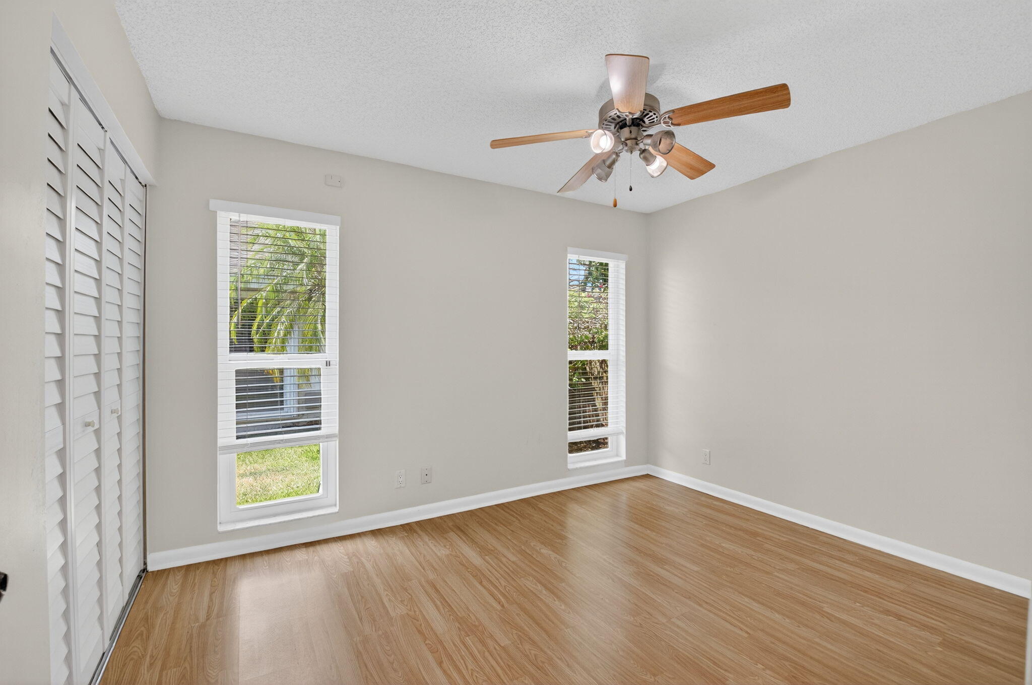 17414 Springtree Lane Boca Raton, FL 33487 - Photo 33 of 49 wooden floor in an empty room with a window