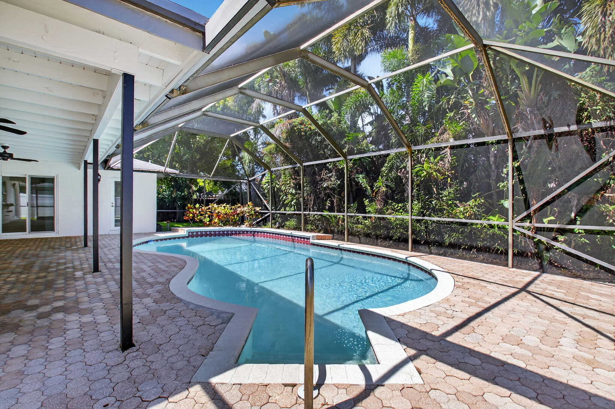 17414 Springtree Lane Boca Raton, FL 33487 - Photo 38 of 49 a view of a balcony with chairs and wooden floor