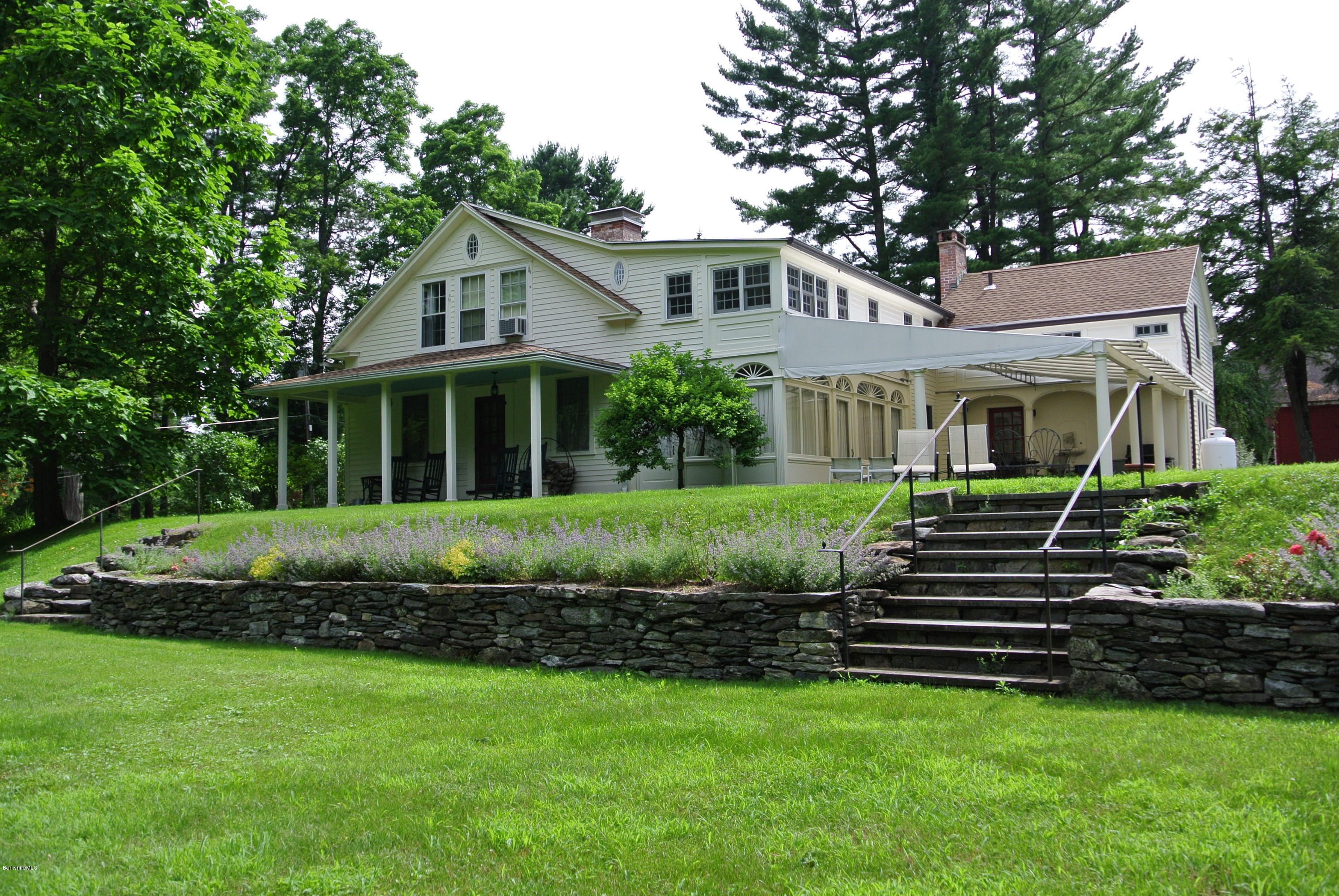 1 Interlaken Road Stockbridge, MA 01262 - Photo 23 of 27 a front view of a house with a garden