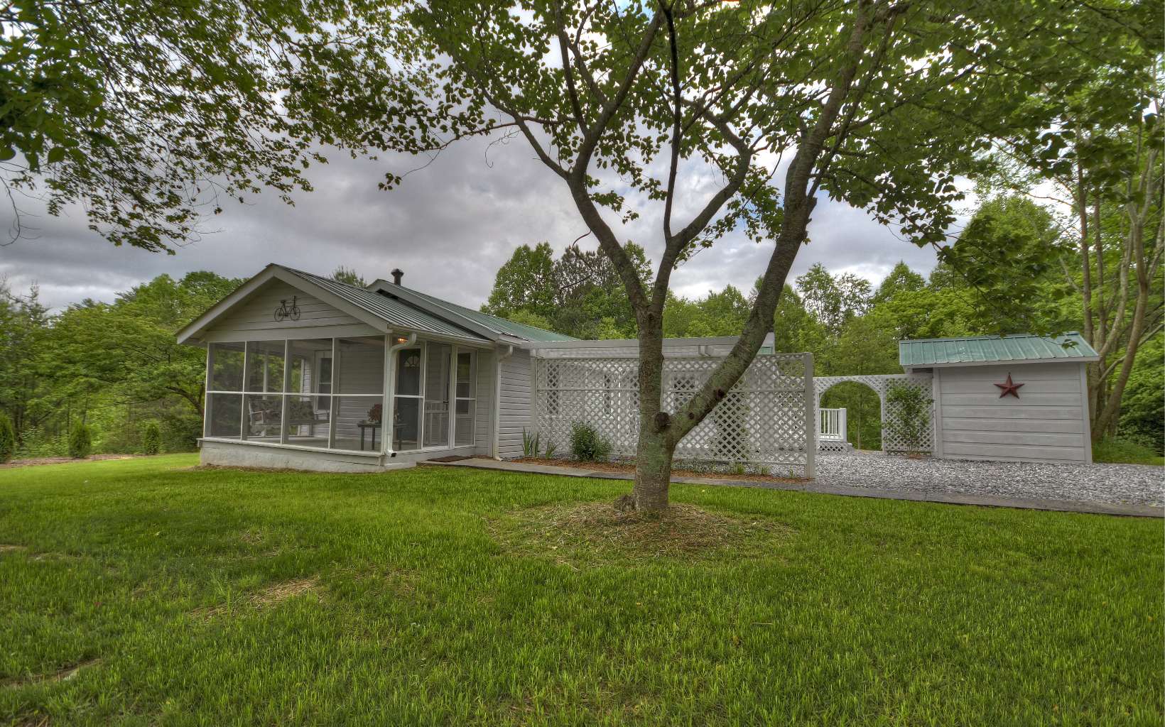 1780 Ada Street Blue Ridge, GA 30513 - Photo 1 of 1 a view of a house with a yard and a large tree